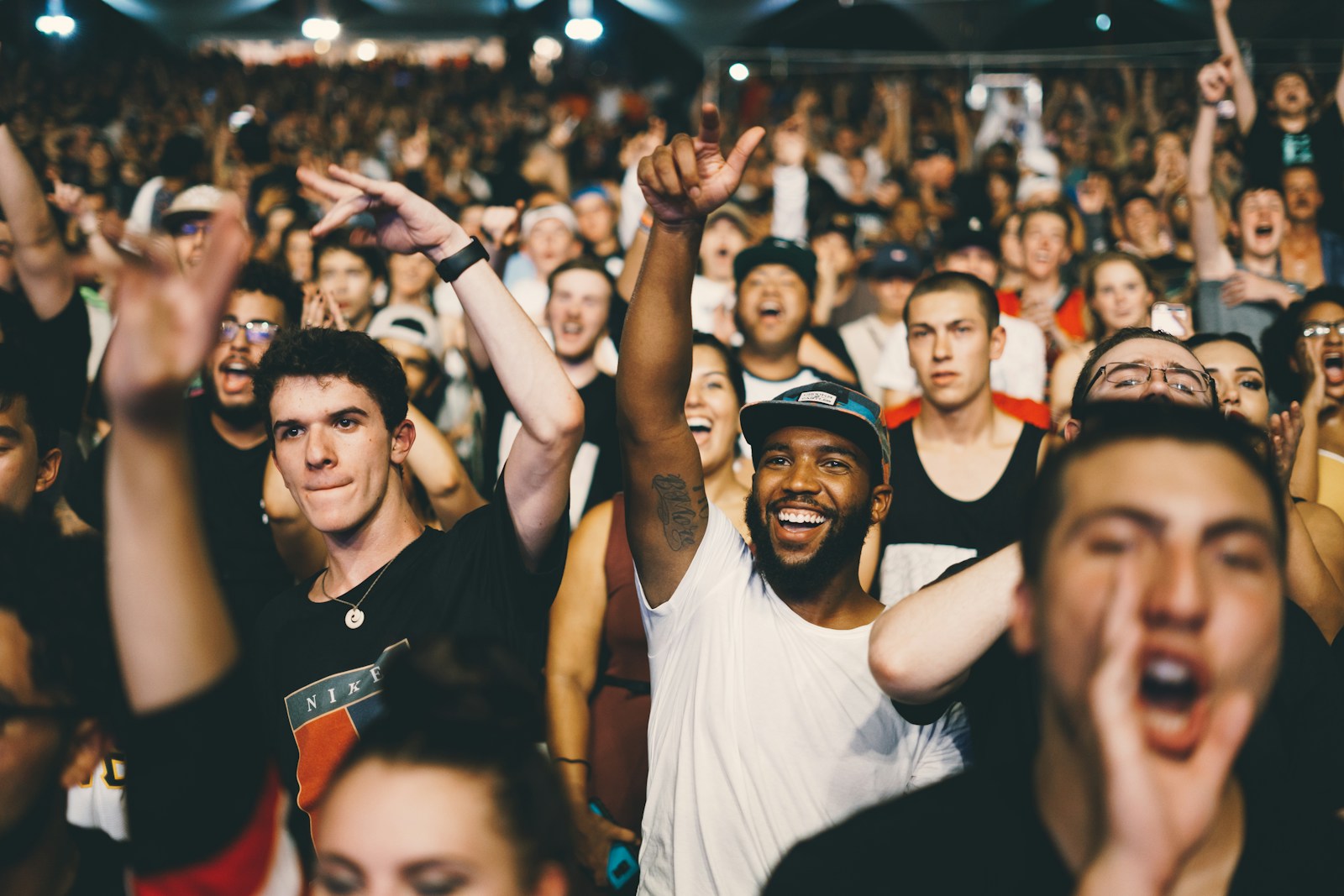 Hands raised in the concert crowd